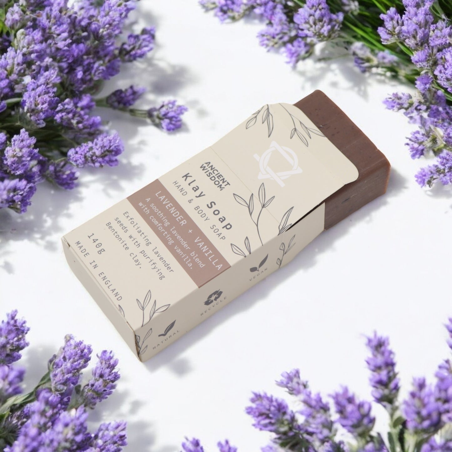 Lavender & Vanilla clay soap bar on white with lavender sprigs display