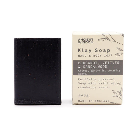 Close-up of bar showing texture and cranberry seed exfoliant and box