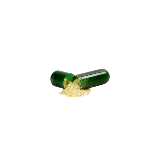 Open capsule with green powder spilling out