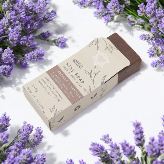 Lavender & Vanilla clay soap bar on white with lavender sprigs display