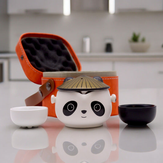 Ceramic panda teapot with a bamboo lid on a kitchen counter