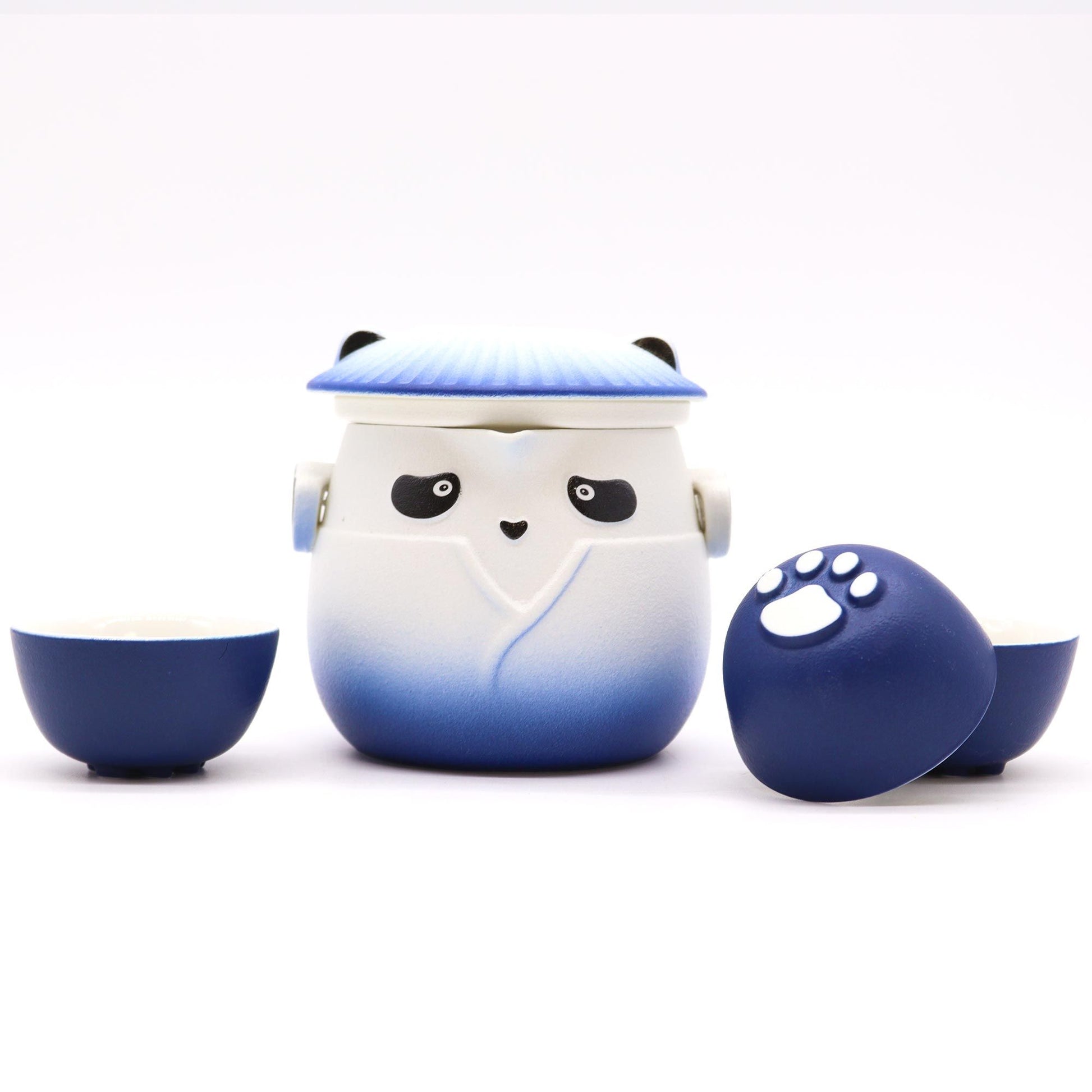 Ceramic tea set with panda design on a white background