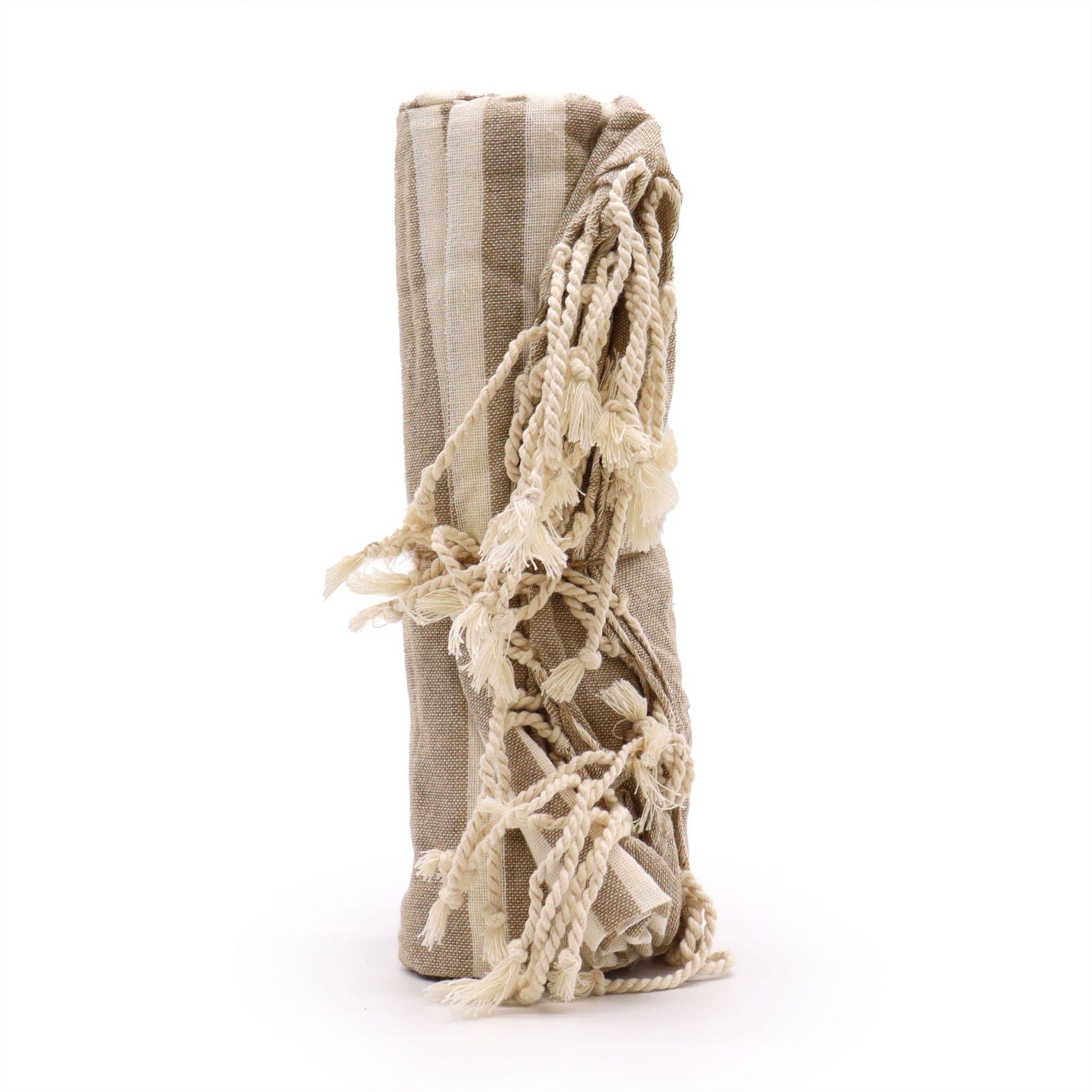 Rolled warm-sand cotton throw included in the Rainy Window Ritual