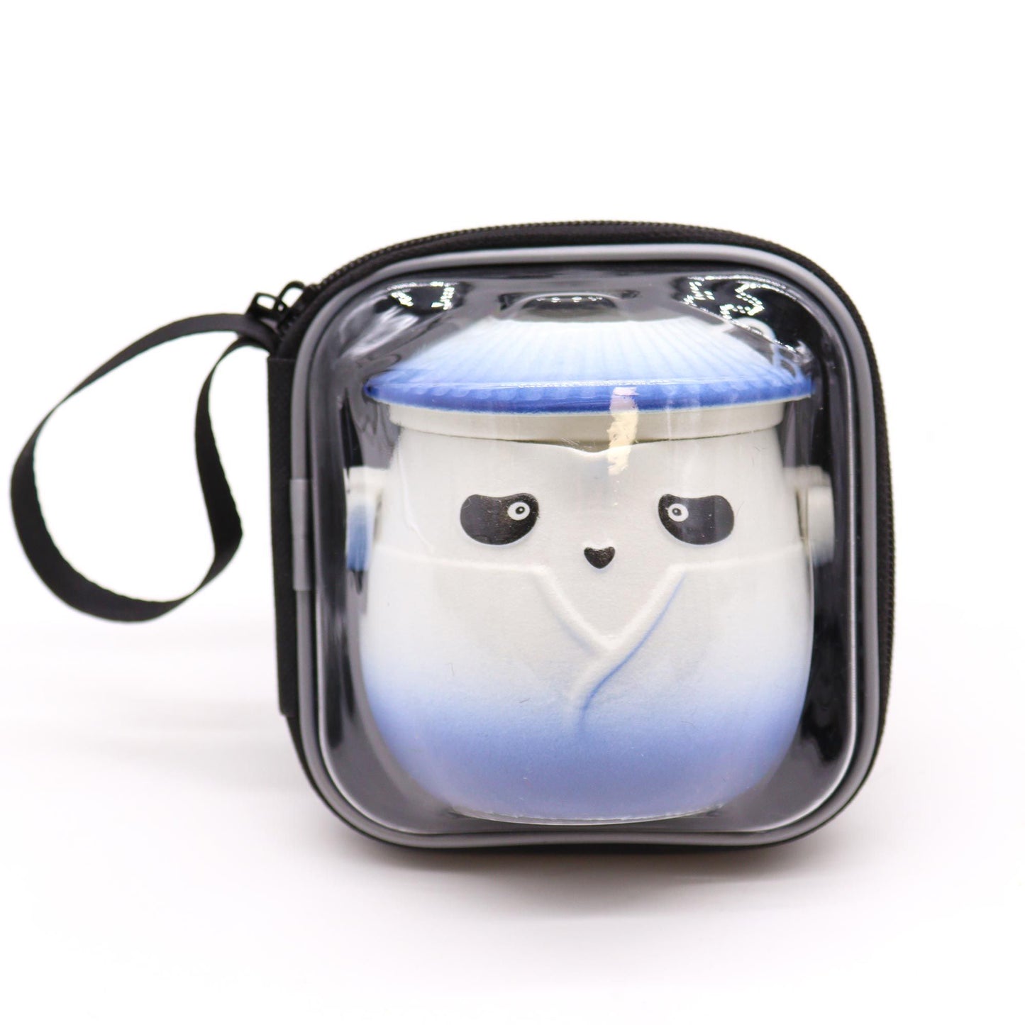 Candle in the shape of a ghost with a blue gradient in a clear container with a black lid.