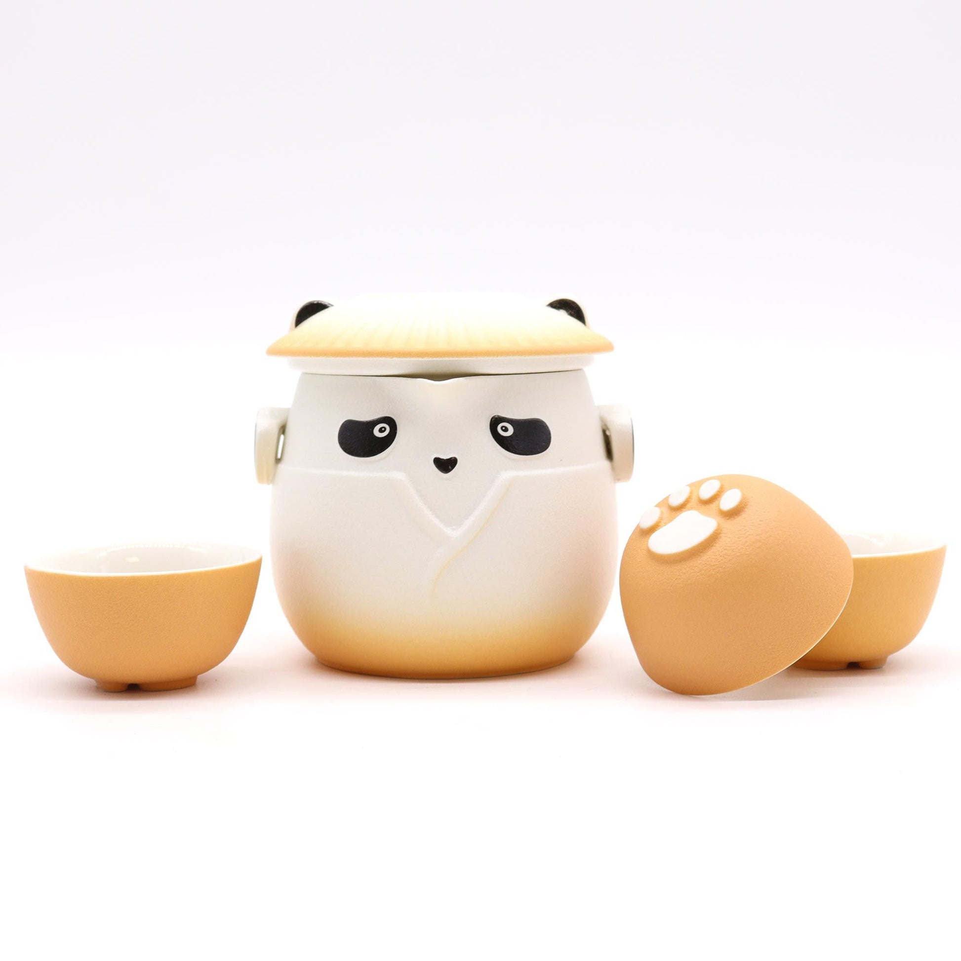 Cute ceramic egg-shaped container with a lid, resembling a chick, on a white background.