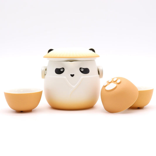 Cute ceramic egg-shaped container with a lid, resembling a chick, on a white background.