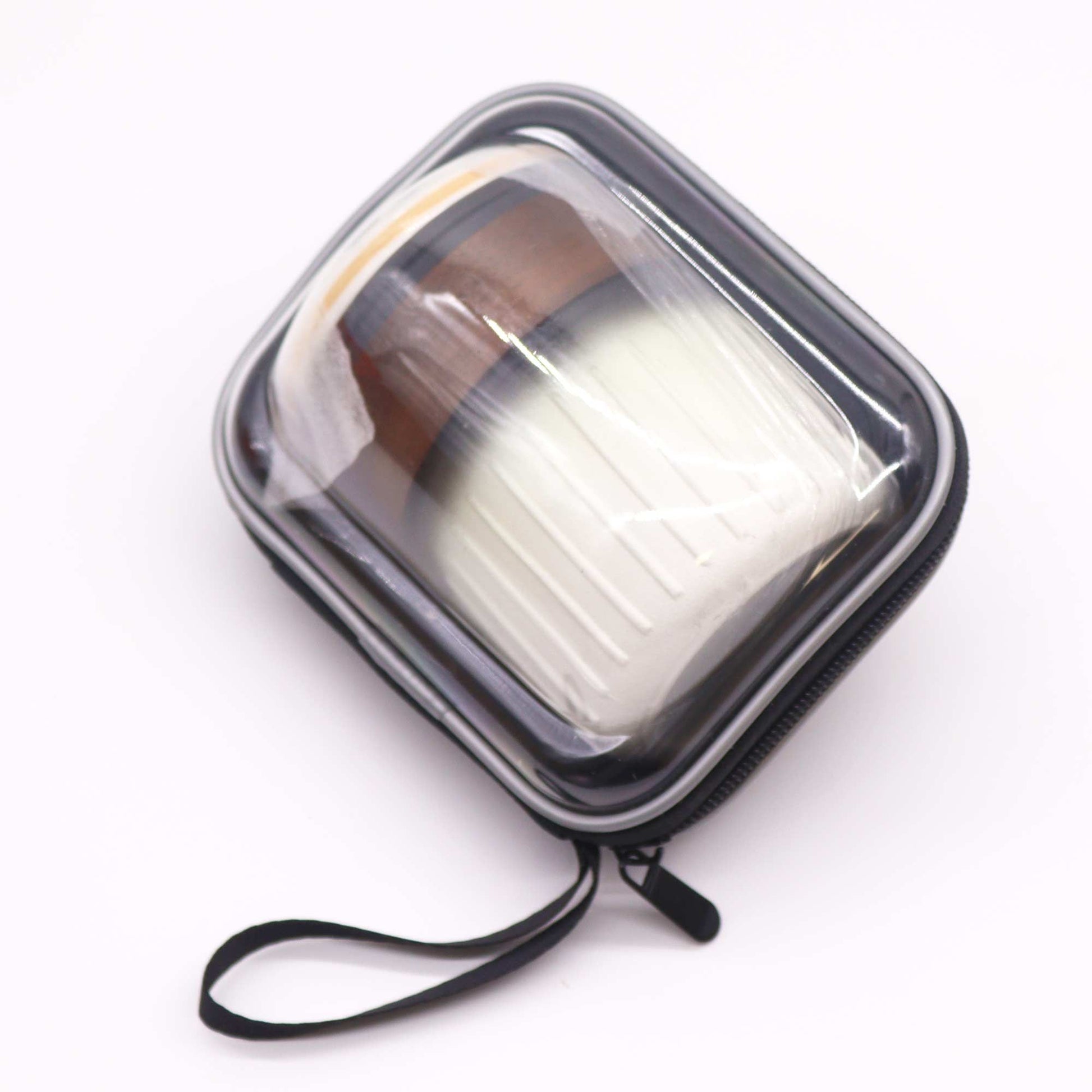 Clear makeup case with a black zipper on a white background